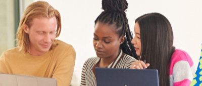 three people discussing while looking at the mobile and smiling