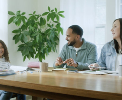 Three people discussing something in smiling face