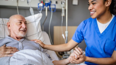 A nurse comforting a patient