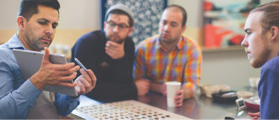 A group of men sitting at a table