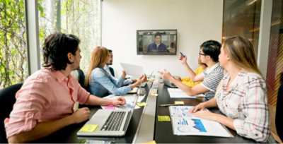 A group of people sitting at a table.
