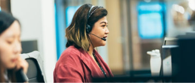 A woman wearing a headset.