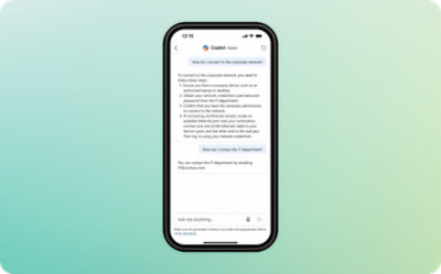 A cell phone with text on the screen against a blue and white background.