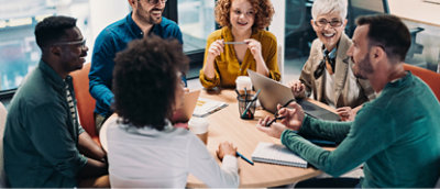 A group of people sitting around a table.