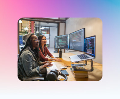 A group of women looking at computers