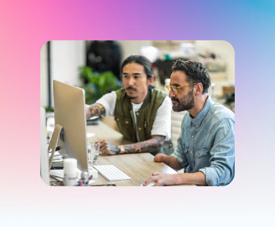 A group of men looking at a computer screen
