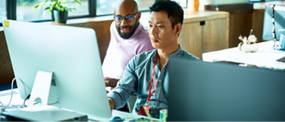 A man sitting at a desk with a computer.