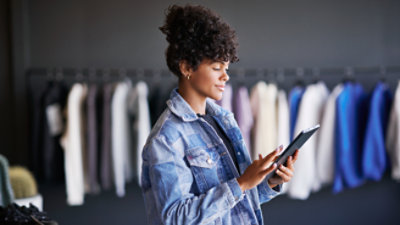 A woman holding a tablet.