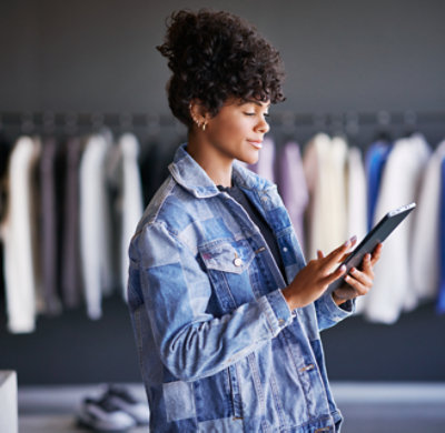 A woman holding a tablet.