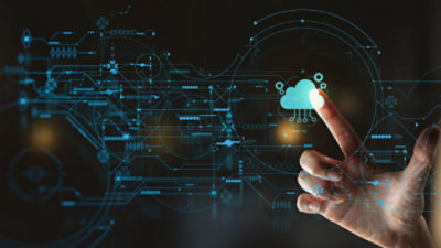 A hand touching a cloud computing interface.