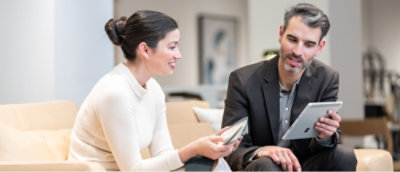 A person and another person sitting and talking