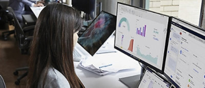 Women working on different screens.