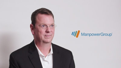 Professional headshot with ManpowerGroup logo on a light background