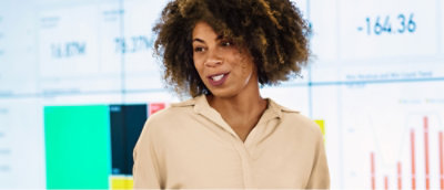 A close up of a woman's face with curly hair.