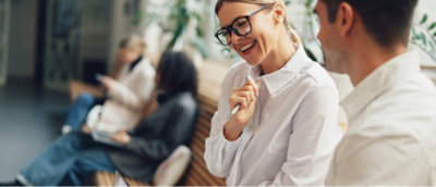 A close up of a woman wearing glasses.