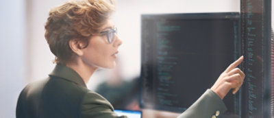 A woman looking at a computer screen.