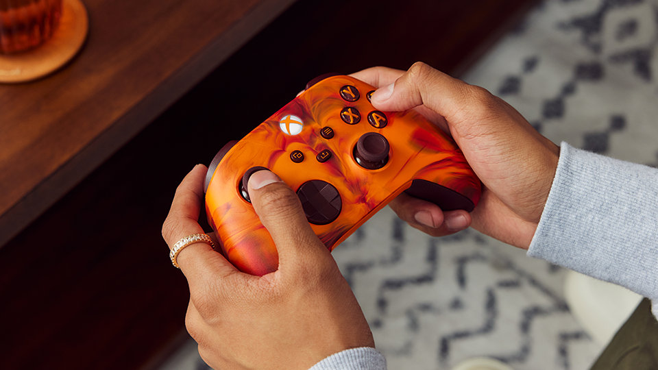 Close-up of the Xbox, view, menu and share buttons on the Xbox Wireless Controller – Fire Vapor Special Edition.