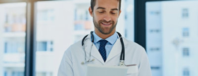 A doctor with a stethoscope around his neck.