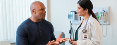A man and woman talking to each other.