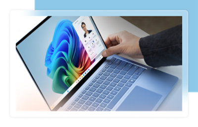 A hand holding a computer