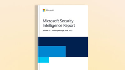 A close-up of a book cover with text that reads Microsoft Security Intelligence Report Volume 15: January–June 2013.