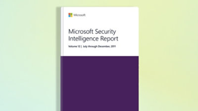 A close-up of a book with a white and purple cover displaying the title Microsoft Security Intelligence Report Volume 12: July–December 2011.