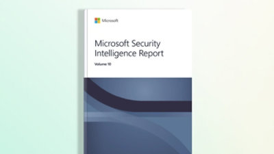 A close-up of a book with a white and blue cover featuring the text Microsoft Security Intelligence Report Volume 10.