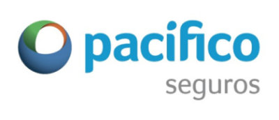 A high angle view of a city with tall buildings and white clouds in the blue sky.