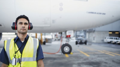 A person wearing a headset in an airport