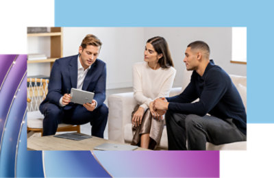 Three people are gathered, engaged in discussion.