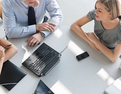 A group of people sitting around a table.