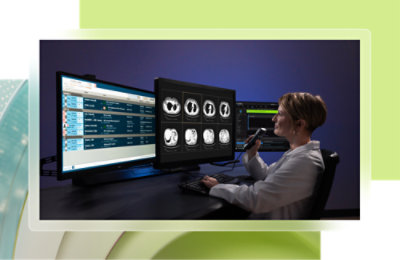 A woman in a lab coat using a radiograph computer screen.