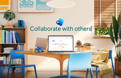 Home office setup featuring a laptop open on a desk with the text "collaborate with others!" on the screen, surrounded by books, a plant, and floating app icons.