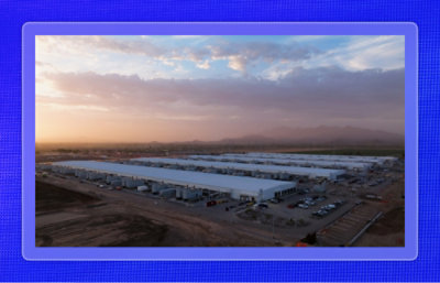 Aerial view of a Microsoft datacenter campus in Arizona with multiple server buildings under a sunrise sky.
