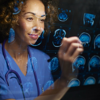 A doctor writing on a transparent board