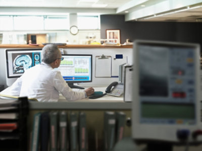 A person looking at a computer screen