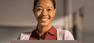 a person pointing to a large desktop monitor