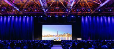 A large screen with a city skyline in the background.