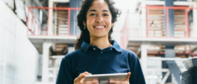 A woman holding a tablet.