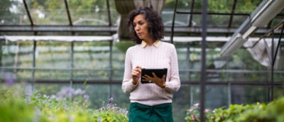 A woman holding a tablet.