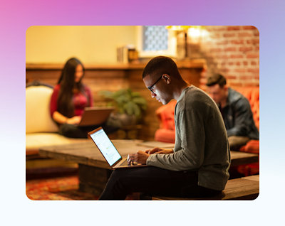Person staring at a computer in a public place