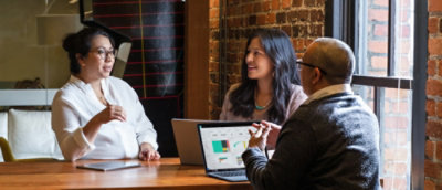 A group of people sitting around a table.