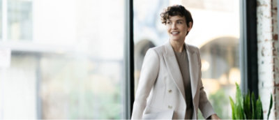 A woman in a white suit.