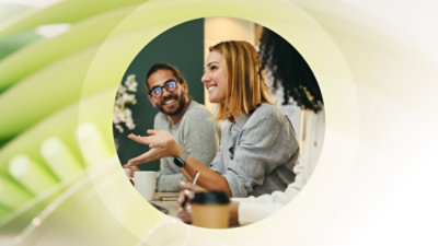 A woman smiling in a work meeting