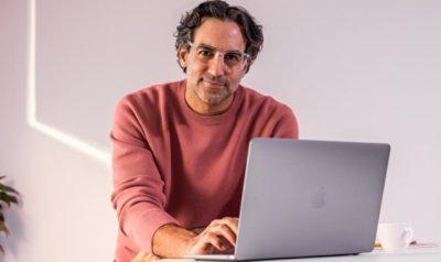 A men working with laptop.