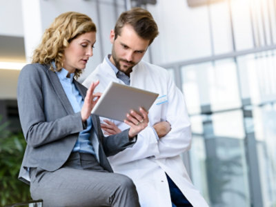 Professionals checking tablet