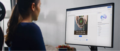 A person looking at a computer screen