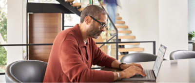 A person sitting at a desk using a computer