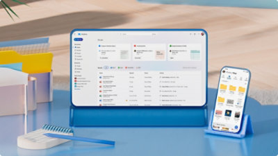 A tablet and phone placed on a desk.