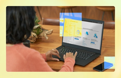 A woman typing on a laptop.